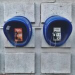 The 48-Hour Digital Swap: Trading Screens for Specific Analog Alternatives two blue telephone booths on wall