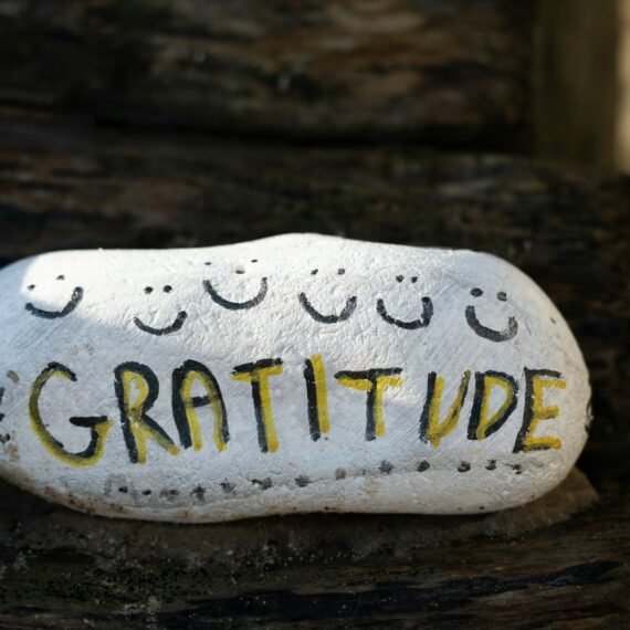 a white and yellow object with writing on it