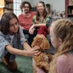 Family Gathering with Pet Dog in Living Room