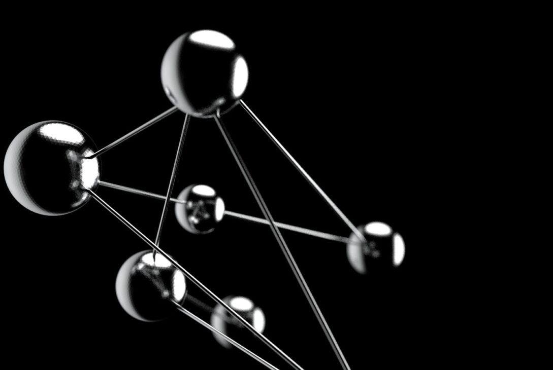 a black and white photo of a group of spheres