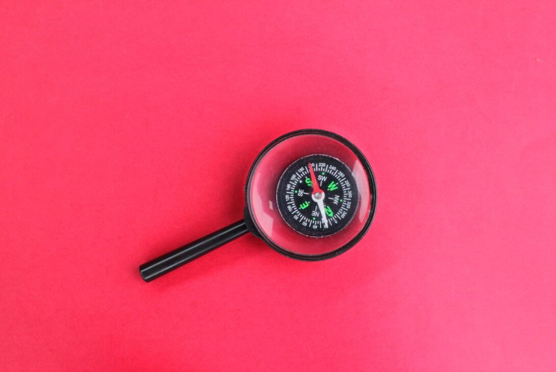 magnifier san compass. concept of direction finding.