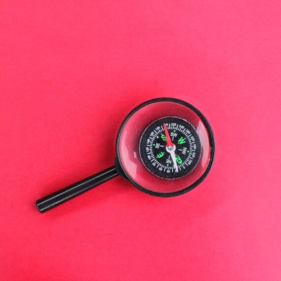 magnifier san compass. concept of direction finding.