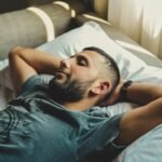 Creating a "Sleep Sanctuary Checklist": Engineering Your Bedroom for Rest man lying on bed
