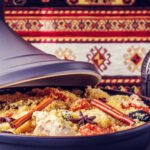 Traditional moroccan tajine of chicken with dried fruits and spices.