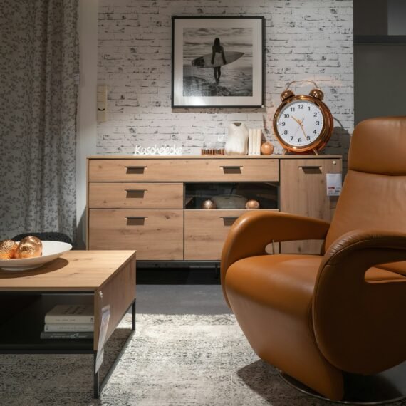 a living room filled with furniture and a clock