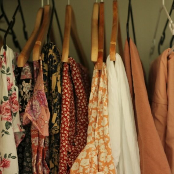 A rack of clothing hanging on a wall