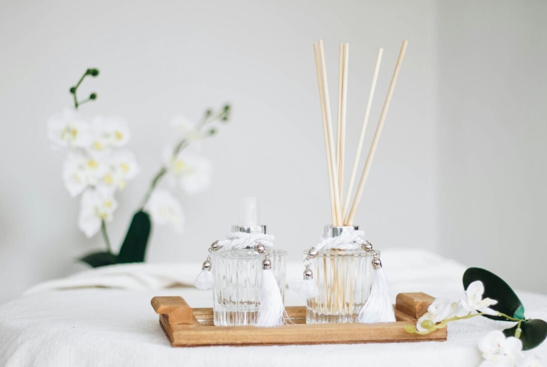 a couple of bottles sitting on top of a wooden tray