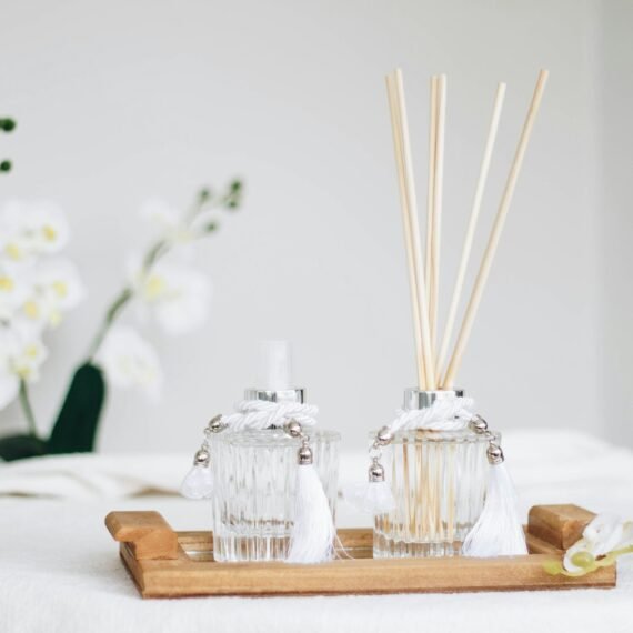 a couple of bottles sitting on top of a wooden tray
